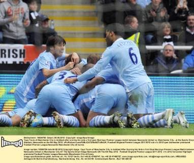 Yaya Toure of Manchester City is mobbed after scoring his side s first goal- Barclays Premier League match between Newcastle United vs. Manchester City - at the Sports Direct Stadium, Newcastle on the 6th May 2012. xPicRichard LeexEDITORIAL USE ONLY. No use with unauthorised audio, video, data, fixture lists, club league logos or live services. Online in-match use limited to 120 images, no video emulation. No use in betting, games or single club league player publications.
