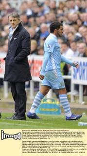 Manchester City s manager Roberto Mancini (L) does not acknowledge Carlos Tevez as he comes off- Barclays Premier League match between Newcastle United vs. Manchester City - at the Sports Direct Stadium, Newcastle on the 6th May 2012. xPicRichard LeexEDITORIAL USE ONLY. No use with unauthorised audio, video, data, fixture lists, club league logos or live services. Online in-match use limited to 120 images, no video emulation. No use in betting, games or single club league player publications.