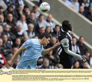 Papiss Cisse of Newcastle United (R) beats Gareth Barry of Manchester City to the ball..Barclays Premier League match between Newcastle Utd v Manchester City at the Sports Direct Stadium, Newcastle on the 6th May 2012. xRichardLeex... EDITORIAL USE ONLY. No use with unauthorised audio, video, data, fixture lists, club league logos or live services. Online in-match use limited to 120 images, no video emulation. No use in betting, games or single club league player publications.