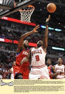 Chicago Bulls forward Luol Deng (R) shoots as Philadelphia 76ers forward Elton Brand defends during the fourth quarter of game 5 of the first round of the Eastern Conference Playoffs at the United Center on May 1, 2012 in Chicago. The Bulls won 77-69, but the 76ers lead the best of seven series 3-2.  CHI2012050829