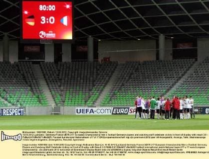10.05.2012 Ljubljana - Germany-France UEFA U17 European Championship men s football Germany players and coaching staff celebrate victory in front of display with result 3:0 - 