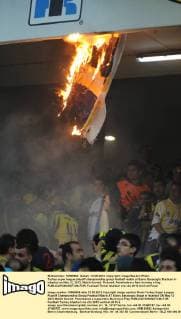Turkey super league playoff championship group football match at Sukru Saracoglu Stadium in Istanbul on May 12, 2012. Match Scored: Pictured: Fenerbahce s fans burning a flag . 