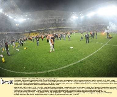 Turkey super league playoff championship group football match between Fenerbahce and Galatasaray at Sukru Saracoglu Stadium in Istanbul on May 12, 2012. Match Scored: Fenerbahce 0 - Galatasaray 0 Pictured: Fenerbahce s fans clash with Turkish riot policemen after the victory of Galatasaray at the end of their Turkish Super League playoff final football match at Sukru Saracoglu Stadium in Istanbul, on May 12, 2012. The game ended with a draw 0-0. 