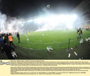 Turkey super league playoff championship group football match between Fenerbahce and Galatasaray at Sukru Saracoglu Stadium in Istanbul on May 12, 2012. Match Scored: Fenerbahce 0 - Galatasaray 0 Pictured: Fenerbahce s fans clash with Turkish riot policemen after the victory of Galatasaray at the end of their Turkish Super League playoff final football match at Sukru Saracoglu Stadium in Istanbul, on May 12, 2012. The game ended with a draw 0-0. 