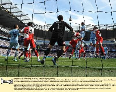 Football - Premier League - Manchester City vs. Queens Park Rangers Manchester City s Edin Dzeko rises to head in their second goal past Paddy Kenny of Queens Park Rangers at the Etihad Stadium, Manchester 