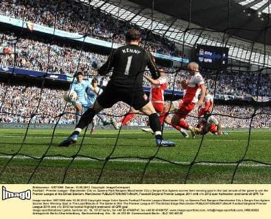 Football - Premier League - Manchester City vs. Queens Park Rangers Manchester City s Sergio Kun Agüero scores their winning goal in the last minute of the game to win the Premier League at the Etihad Stadium, Manchester 