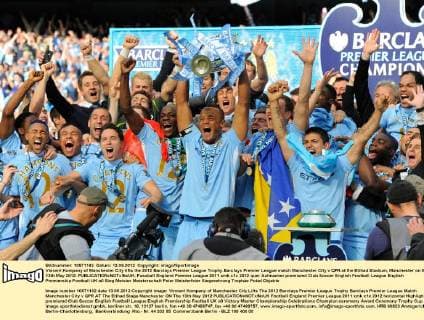 Vincent Kompany of Manchester City lifts the 2012 Barclays Premier League Trophy.Barclays Premier League match Manchester City v QPR at the Etihad Stadium, Manchester on the 13th May 2012. EDITORIAL USE ONLY. No use with unauthorised audio, video, data, fixture lists, club league logos or live services. Online in-match use limited to 120 images, no video emulation. No use in betting, games or single club league player publications.