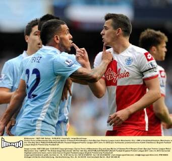 Carlos Tevez of Manchester City and Joey Barton of Queens Park Rangers clash.Barclays Premier League match Manchester City v QPR at the Etihad Stadium, Manchester on the 13th May 2012. EDITORIAL USE ONLY. No use with unauthorised audio, video, data, fixture lists, club league logos or live services. Online in-match use limited to 120 images, no video emulation. No use in betting, games or single club league player publications.