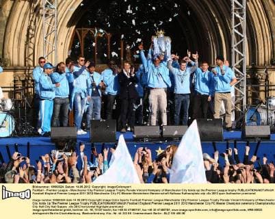 Football - Premier League - Manchester City Premier League Trophy Parade Vincent Kompany of Manchester City holds up the Premier League trophy 