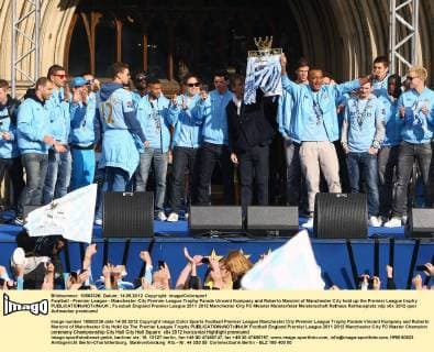 Football - Premier League - Manchester City Premier League Trophy Parade Vincent Kompany and Roberto Mancini of Manchester City hold up the Premier League trophy 