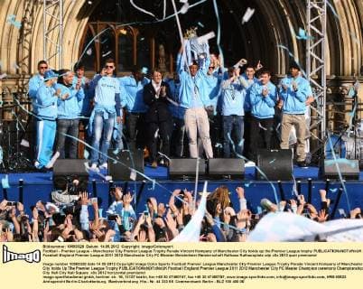 Football - Premier League - Manchester City Premier League Trophy Parade Vincent Kompany of Manchester City holds up the Premier League trophy 