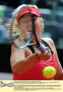 Maria Sharapova of Russia returns the ball during the women s singles semifinal match at the Rome Masters tennis tournament in Rome - 