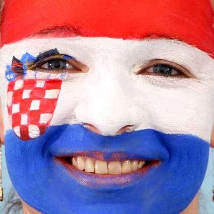 FUSSBALL - UEFA EURO 2012, Fotoshooting GRAZ,AUSTRIA,22.MAI.12 - FUSSBALL, Vorschau, Fotoshooting. Archivbild zeigt ein Model mit der kroatischen Fahne als Gesichtsbemalung. Keywords: Bodypainting, Flagge, Kroatien, Fan. - MODEL RELEASED - 