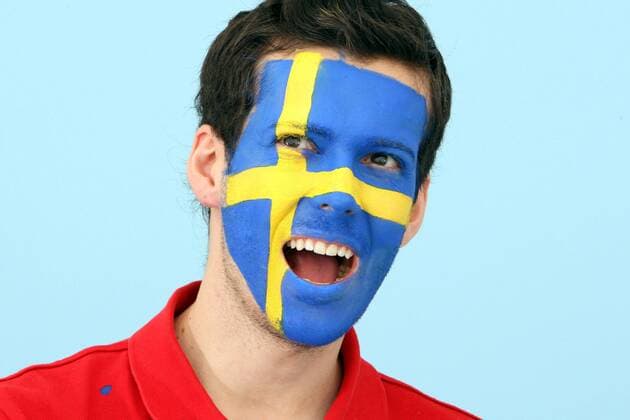 FUSSBALL - UEFA EURO 2012, Fotoshooting GRAZ,AUSTRIA,22.MAI.12 - FUSSBALL, Vorschau, Fotoshooting. Archivbild zeigt ein Model mit der schwedischen Fahne als Gesichtsbemalung. Keywords: Bodypainting, Flagge, Schweden, Fan. - MODEL RELEASED - 