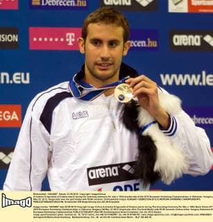 Aristeidis Grigoriadis of Greece reacts during the awarding ceremony for men s 100m backstroke at the 2012 European Swimming Championships in Debrecen, Hungary on May 22, 2012. Grigoriadis won the gold medal with 53.86 seconds. (Xinhua Attila Volgyi) HUNGARY-DEBRECEN-2012 EUROPEAN SWIMMING CHAMPIONSHIPS 
