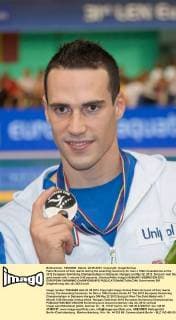 Fabio Scozzoli of Italy reacts during the awarding ceremony for men s 100m breaststroke at the 2012 European Swimming Championships in Debrecen, Hungary on May 22, 2012. Scozzoli won the gold medal with 1 minute 0.55 seconds. (Xinhua Attila Volgyi) HUNGARY-DEBRECEN-2012 EUROPEAN SWIMMING CHAMPIONSHIPS 