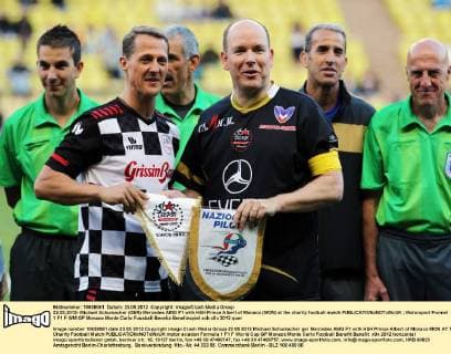 22.05.2012- Michael Schumacher (GER) Mercedes AMG F1 with HSH Prince Albert of Monaco (MON) at the charity football match 