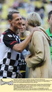 22.05.2012- Michael Schumacher (GER) Mercedes AMG F1 with Princess Charlene of Monaco at the charity football match. 