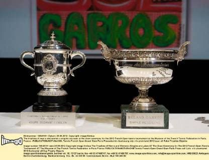 The trophies of men s and women s singles are seen at the draw ceremony for the 2012 French Open tennis tournament at the Museum of the French Tennis Federation in Paris, France - 