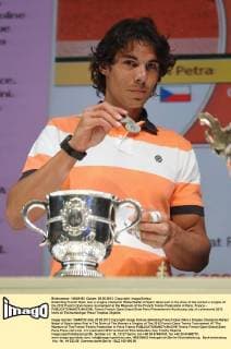 Defending French Open men s singles champion Rafael Nadal of Spain takes part in the draw of the women s singles of the 2012 French Open tennis tournament at the Museum of the French Tennis Federation in Paris, France - 
