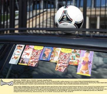 Many Warsaw s escort agencies prepared special leaflets for clients coming for EURO. Leaflets placed in a car s window  EN_01028265_0009