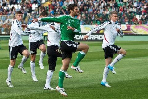 Fitnesstrainer Yann Benjamin Kugel mit Toni Kroos (L) und Lars Bender Germany s national soccer player during official training session in Gdansk, June 4 2012 delu_040612 