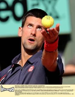 Serbian Novak Djokovic prepares to serve during his French Open men s semifinal match at Roland Garros in Paris on June 8, 2012.  PAR20120608736