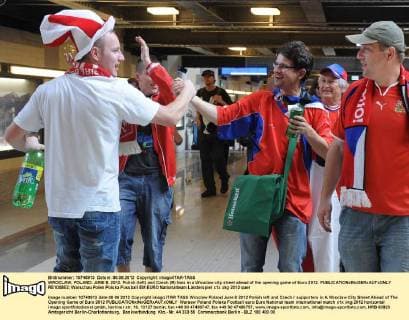 WROCLAW, POLAND. JUNE 8, 2012. Polish (left) and Czech (R) fans in a Wroclaw city street ahead of the opening game of Euro 2012.  RE1008E2