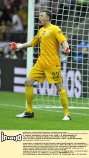 Przemyslaw Tyton, goalkeeper of Poland reacts during the Group A match against Greece at the Euro 2012 football championship in Warsaw, Poland, June 8, 2012. (Xinhua Ma Ning) (jyc) POLAND-WARSAW-EURO 2012 FOOTBALL CHAMPIONSHIP-POLAND VS GREECE 