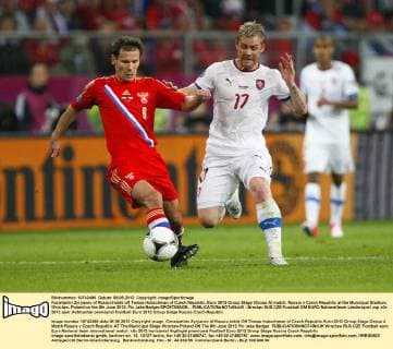 Konstantin Zyryanov of Russia holds off Tomas Hubschman of Czech Republic..Euro 2012 Group Stage (Group A) match, Russia v Czech Republic at the Municipal Stadium, Wroclaw, Poland on the 8th June 2012. Pic Jake Badger SPORTIMAGE... EDITORIAL USE ONLY. No use with unauthorised audio, video, data, fixture lists, club league logos or live services. Online in-match use limited to 120 images, no video emulation. No use in betting, games or single club league player publications.