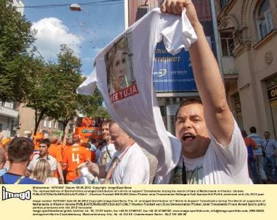The representatives of Batlivshchina arranged distribution of t-shirts in support Tymoshenko during the march of fans of Netherlands in Kharkiv, Ukraine 