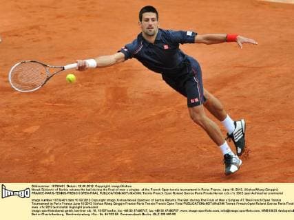 Novak Djokovic of Serbia returns the ball during the final of men s singles at the French Open tennis tournament in Paris, France, June 10, 2012. (Xinhua Wang Qingqin) FRANCE-PARIS-TENNIS-FRENCH OPEN-FINAL 