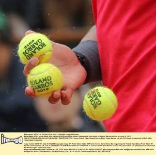 Rafael Nadal (ESP) holds tennis balls before serving during his French Open men s final match at Roland Garros in Paris on June 10, 2012.  PAR20120610709