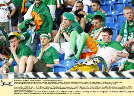 Republic of Ireland fans look on dejected after the final whistle..Euro 2012 Group Stage (Group C) match, at the Municipal Stadium, Poznan on the 10th June 2012. EDITORIAL USE ONLY. No use with unauthorised audio, video, data, fixture lists, club league logos or live services. Online in-match use limited to 120 images, no video emulation. No use in betting, games or single club league player publications.