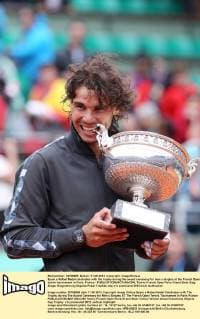 Spain s Rafael Nadal celebrates with the trophy during the award ceremony for men s singles at the French Open tennis tournament in Paris, France - 