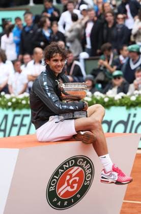 Spain s Rafael Nadal celebrates with the trophy during the awarding ceremony for men s singles at the French Open tennis tournament in Paris - 