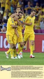 Andriy Shevchenko (front C) of Ukraine celebrates his goal with his teammates during their Group D match against Sweden at the Euro 2012 football championships in Kiev, capital of Ukraine, June 11, 2012. (Xinhua Ma Ning)(kh) UKRAINE-KIEV-EURO 2012-GROUP D-UKRAINE VS SWEDEN 
