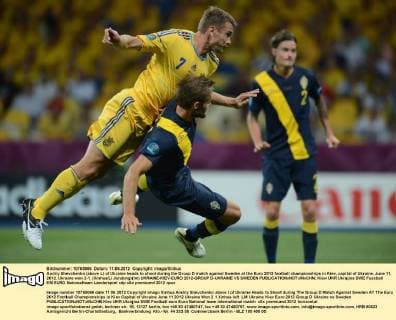 Andriy Shevchenko (above L) of Ukraine heads to shoot during the Group D match against Sweden at the Euro 2012 football championships in Kiev, capital of Ukraine, June 11, 2012. Ukraine won 2-1. (Xinhua Li Jundong)(lm) UKRAINE-KIEV-EURO 2012-GROUP D-UKRAINE VS SWEDEN 