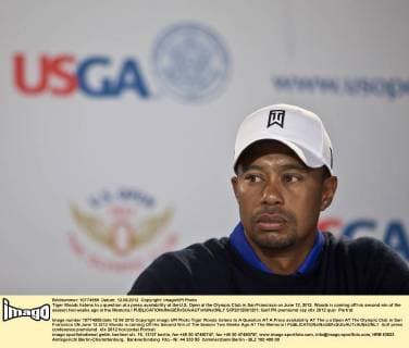 Tiger Woods listens to a question at a press availability at the U.S. Open at the Olympic Club in San Francisco on June 12, 2012. Woods is coming off his second win of the season two weeks ago at the Memoria.l  SXP2012061201