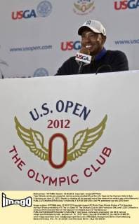 Tiger Woods smiles at a question during a press availability at the U.S. Open at the Olympic Club in San Francisco on June 12, 2012. Woods is coming off his second win of the season two weeks ago at the Memoria.l  SXP2012061206