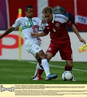 LVIV, June 13, 2012 -- Nani (L) of Portugal vies with Christian Eriksen of Denmark during their Group B 2nd round match in Lviv, Ukraine, June 13, 2012. (Xinhua Li Jundong) (jyc) UKRAINE-LVIV-EURO 2012 FOOTBALL CHAMPIONSHIPS-DENMARK VS PORTUGAL 