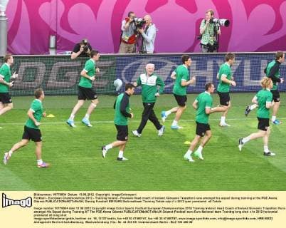 Football - European Championships 2012 - Training Ireland - Previews Head coach of Ireland, Giovanni Trapattoni runs amongst his squad during training at the PGE Arena, Gdansk 