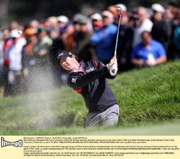 Rory McIlroy of England hits out of a bunker on the 7th fairway during a practice round prior to the start of the 112th U.S. Open Championship at the Olympic Club in San Francisco, California on June 13, 2012.  SFP20120613203