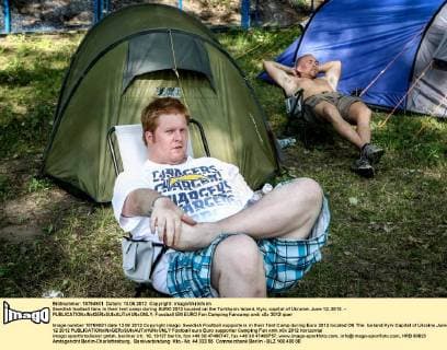 Swedish football fans in their tent camp during EURO 2012 located on the Turkhaniv Island, Kyiv, capital of Ukraine, June 12, 2012. - 