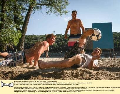 Swedish football fans in their tent camp during EURO 2012 located on the Turkhaniv Island, Kyiv, capital of Ukraine, June 12, 2012. - 