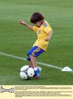Tymur Shamanov, the instant face of Ukraine, plays football during the Ukrainian national football team s training session held at the Dynamo Stadium, Kyiv, capital of Ukraine, June 13, 2012. - 