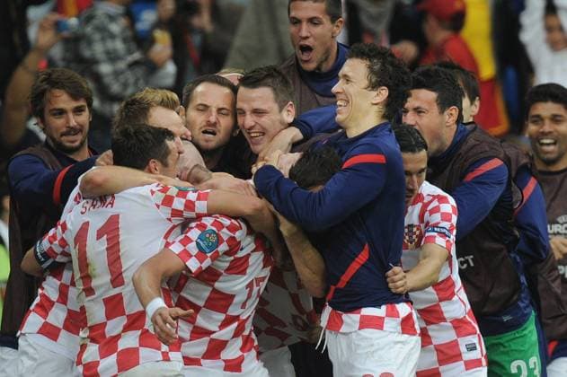 ITAR-TASS: POZNAN, POLAND. JUNE 14, 2012. Croatian players celebrate a goal against Italy in their Euro 2012 Group C football match at Miejski (Municipal) Stadium. The game ended in a 1-1 draw.  Aufmacher RE101216
