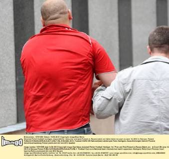 Detained Polish football hooligan, resposible for riots prior and post Poland vs. Russia match are taken taken to court on June 14, 2012 in Warsaw, Poland  EN_01033450_0012