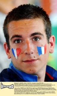 DONETSK, JUNE 15, 2012. French fans with a painted face before a Euro 2012 football match  RE101364