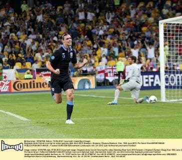 Englands Andy Carroll scoring his sides opening goal..Euro 2012 Sweden v England, Olympic Stadium, Kiev, 15th June 2012. Pic David Klein SPORTIMAGE EDITORIAL USE ONLY. No use with unauthorised audio, video, data, fixture lists, club league logos or live services. Online in-match use limited to 120 images, no video emulation. No use in betting, games or single club league player publications.